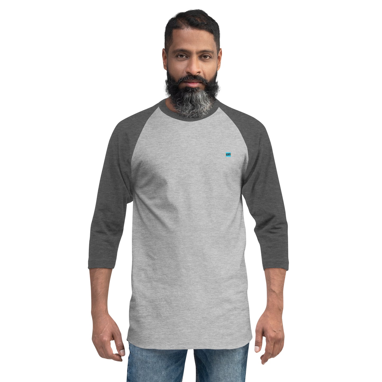 male wearing 3/4 sleeve baseball raglan t-shirt heather gray front with heather charcoal colored sleeves and kiko logo left chest
