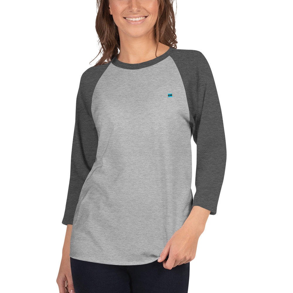 female wearing 3/4 sleeve baseball raglan t-shirt heather gray front with heather charcoal colored sleeves and kiko logo left chest