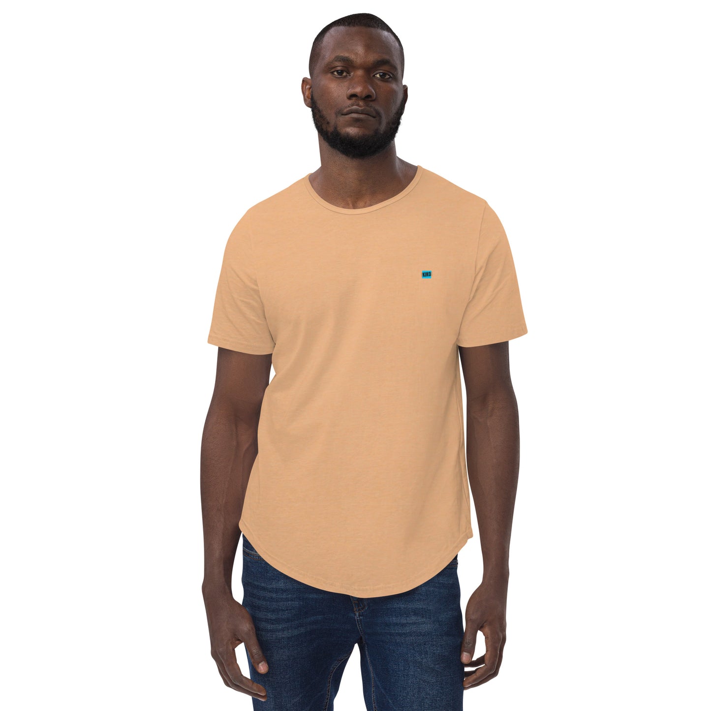 front facing male model wearing Kiko Brand logo heather sand dune color men's curved hem t-shirt with short sleeves and a rounded hem. The fabric is soft and comfortable, making it perfect for casual outings or lounging at home.