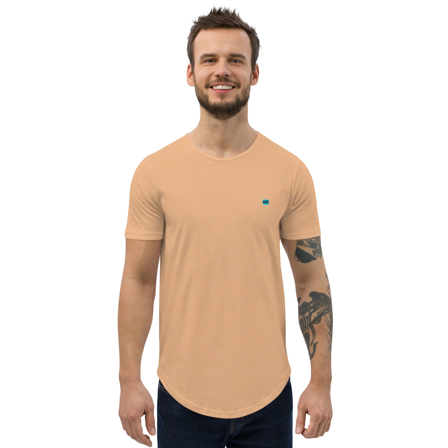 front facing male model wearing Kiko Brand logo heather sand dune color men's curved hem t-shirt with short sleeves and a rounded hem. The fabric is soft and comfortable, making it perfect for casual outings or lounging at home.